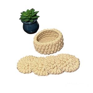 Crochet coaster set of 4 in matching crochet coaster basket in beige.
